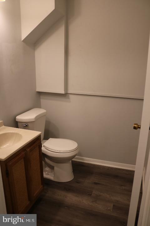 7313 Stream Way Springfield, VA 22152 - Photo 6 of 28 a white toilet sitting next to a bathroom sink