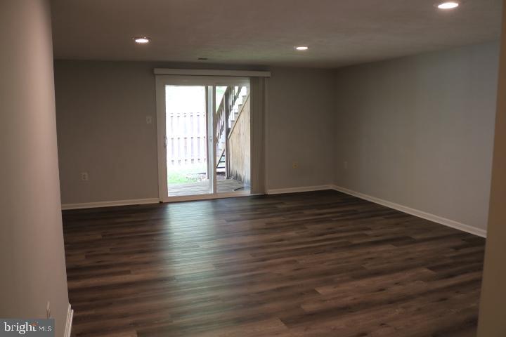 7313 Stream Way Springfield, VA 22152 - Photo 7 of 28 a view of wooden floor and windows in a room
