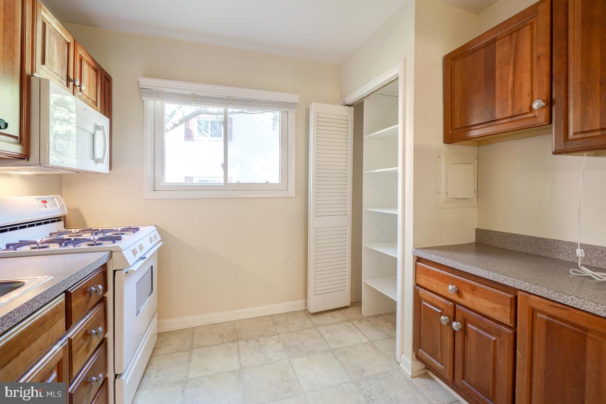 53 Skyhill Road, Unit 204 Alexandria, VA 22314 - Photo 14 of 26 a kitchen with stainless steel appliances granite countertop a stove and a sink