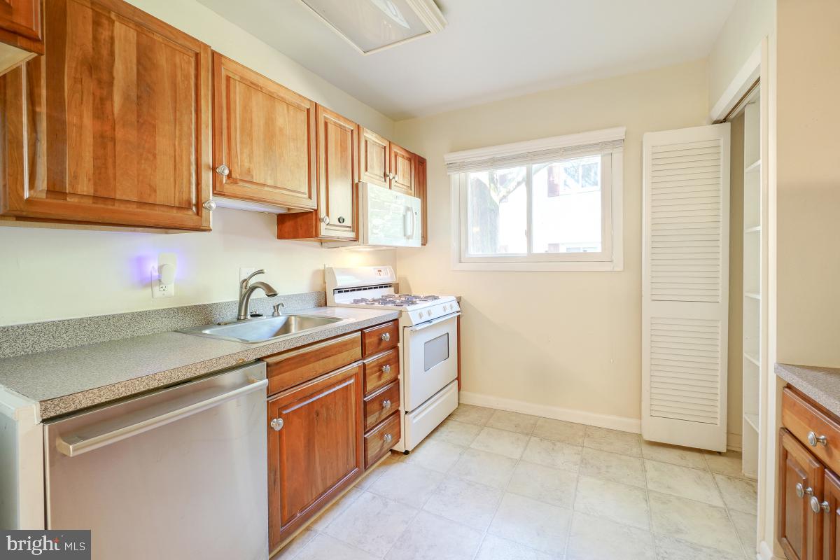 53 Skyhill Road, Unit 204 Alexandria, VA 22314 - Photo 15 of 26 a kitchen with stainless steel appliances granite countertop a sink stove and cabinets