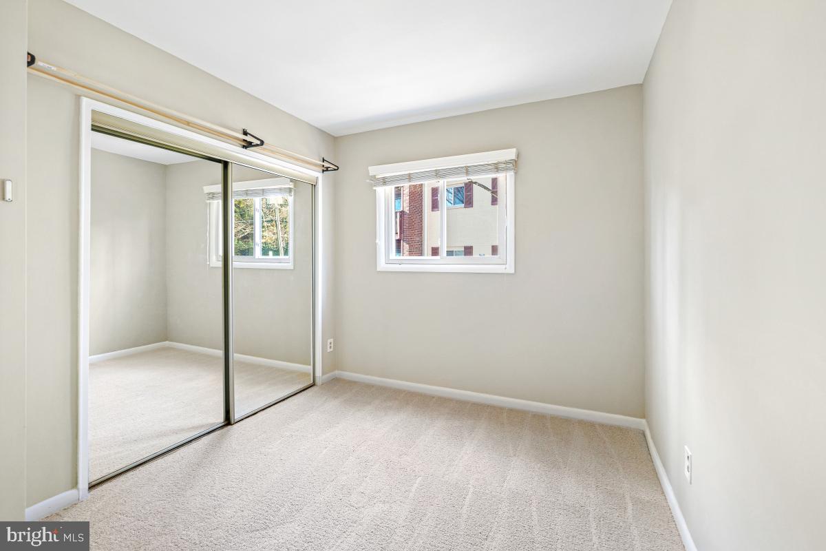 53 Skyhill Road, Unit 204 Alexandria, VA 22314 - Photo 20 of 26 a view of an empty room with a glass door