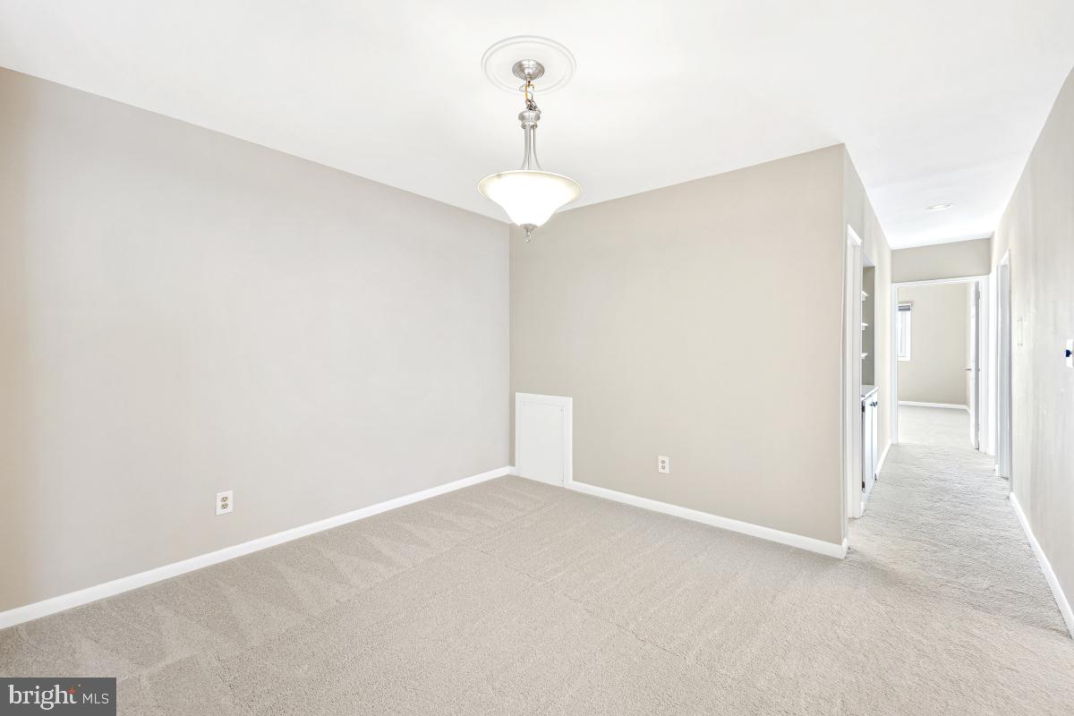 53 Skyhill Road, Unit 204 Alexandria, VA 22314 - Photo 10 of 26 a view of an empty room with a chandelier