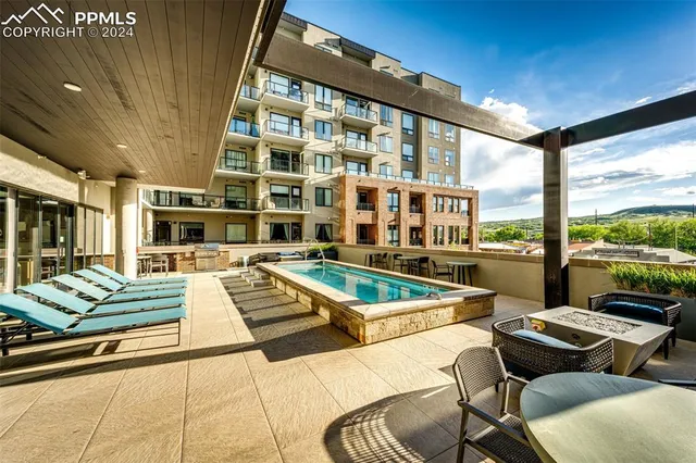 a view of building with lake view and tall buildings
