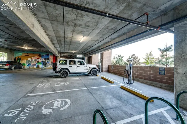 a view of a patio with dining table and chairs with a large tree