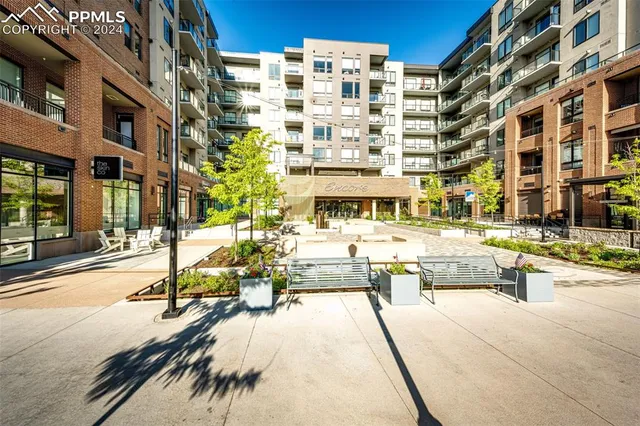 a view of a building with sitting area