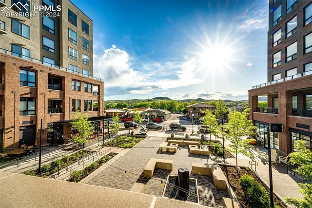 a view of a building with a swimming pool