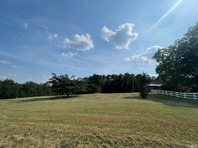 a view of a swimming pool and a yard