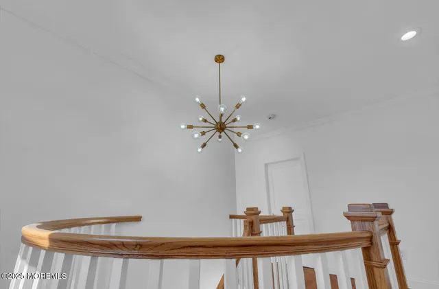 a bathroom with a tub a sink and mirror