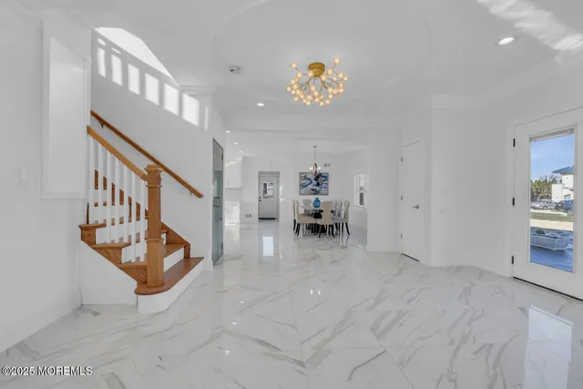 a view of an entryway and livingroom