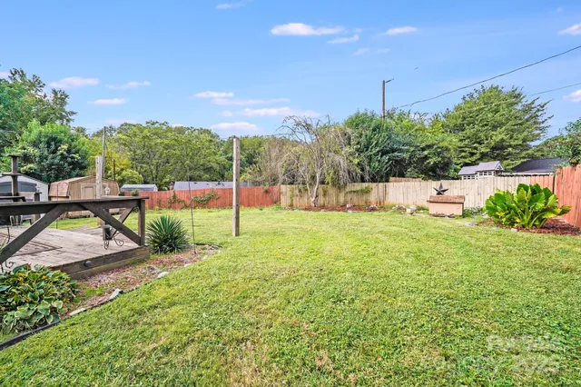 a view of a park with large trees