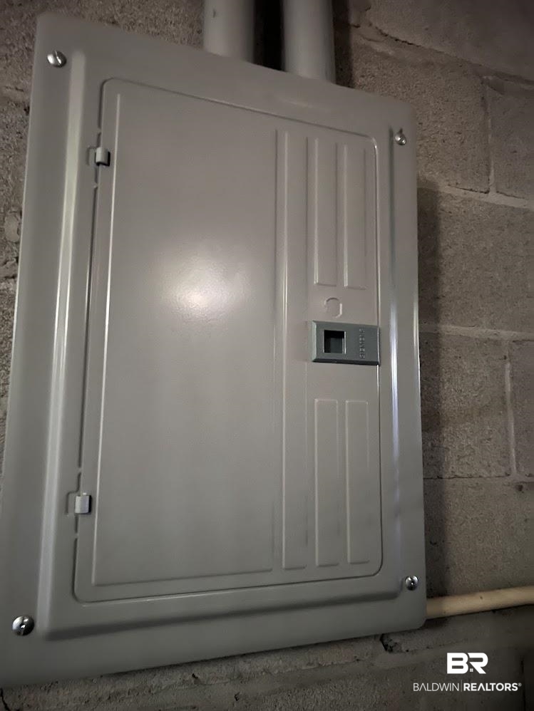 266 Ridgewood Drive Daphne, AL 36526 - Photo 30 of 34 Electrical panel with a light gray finish, mounted on a concrete block wall