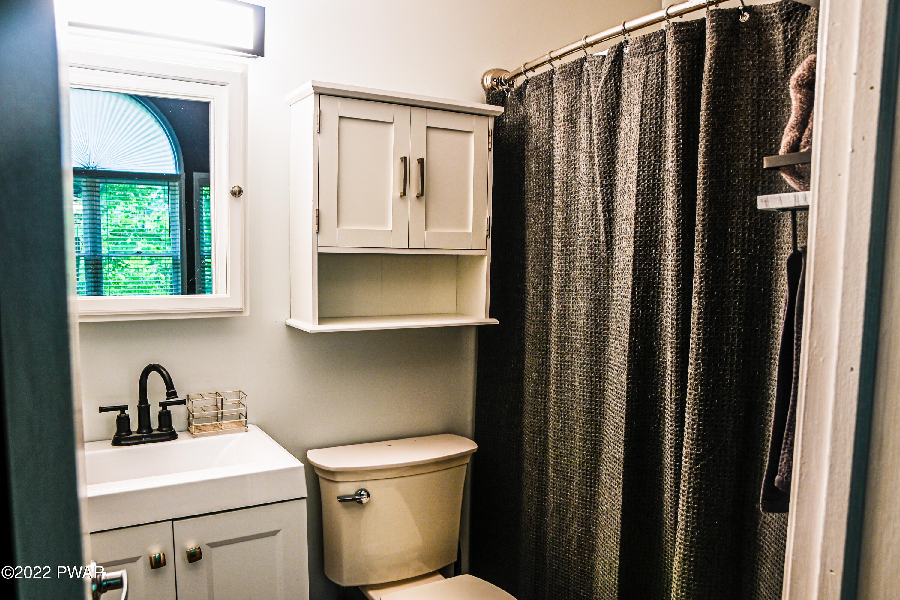 233 Bromley Road Henryville, PA 18332 - Photo 9 of 22 a bathroom with a sink toilet and shower
