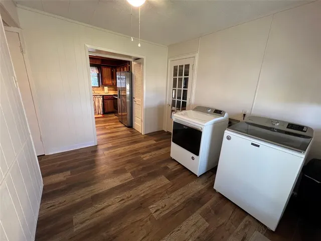 a view of kitchen and wooden floor