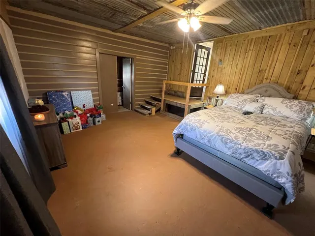 a bed sitting in a room next to a window