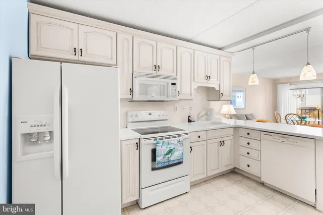 a bedroom with a bed and a lamp