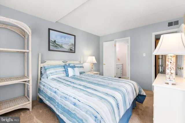a bathroom with a sink toilet vanity and shower