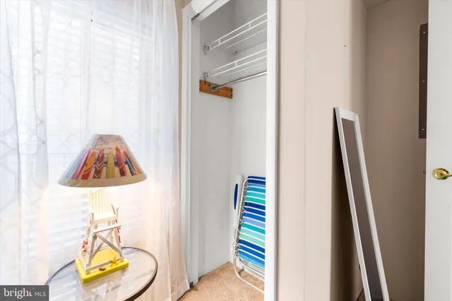 a bathroom with a sink and mirror with toilet
