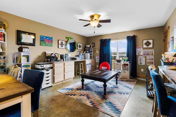 a living room with furniture and kitchen view