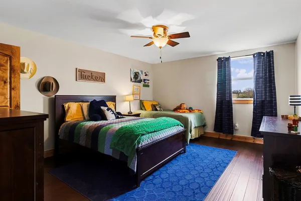 a bedroom with bed and window