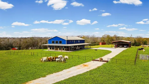 a view of a house with a big yard