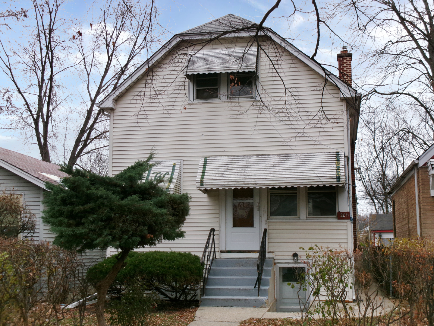 2011 Grey Avenue Evanston, IL 60201 - Photo 1 of 20 a view of a house with a small yard and plants