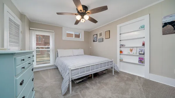 a bedroom with a bed and a cabinets