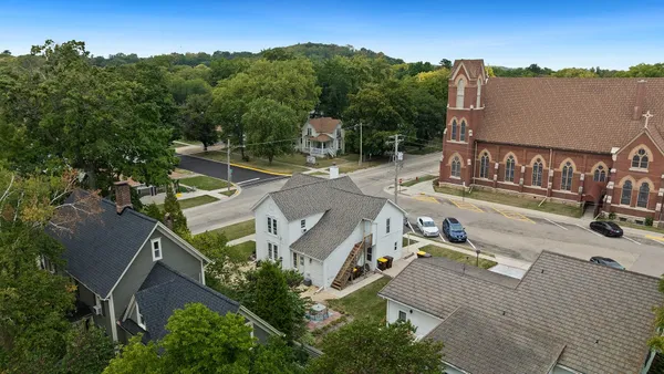 an aerial view of a house with outdoor space