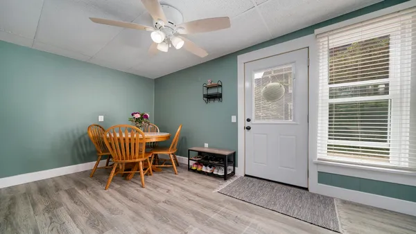 a dining room with furniture and window
