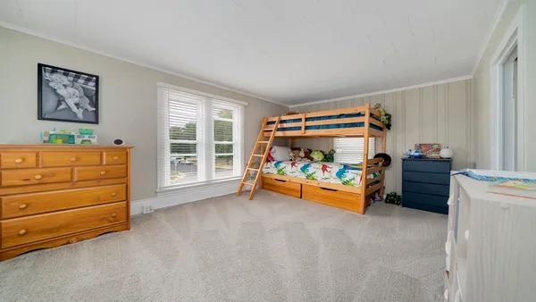 a children room with toys and dresser