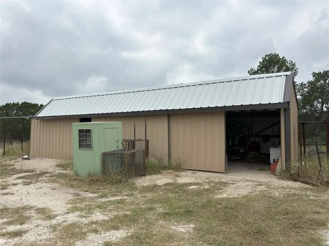 a blue swimming pool with a view of the ocean