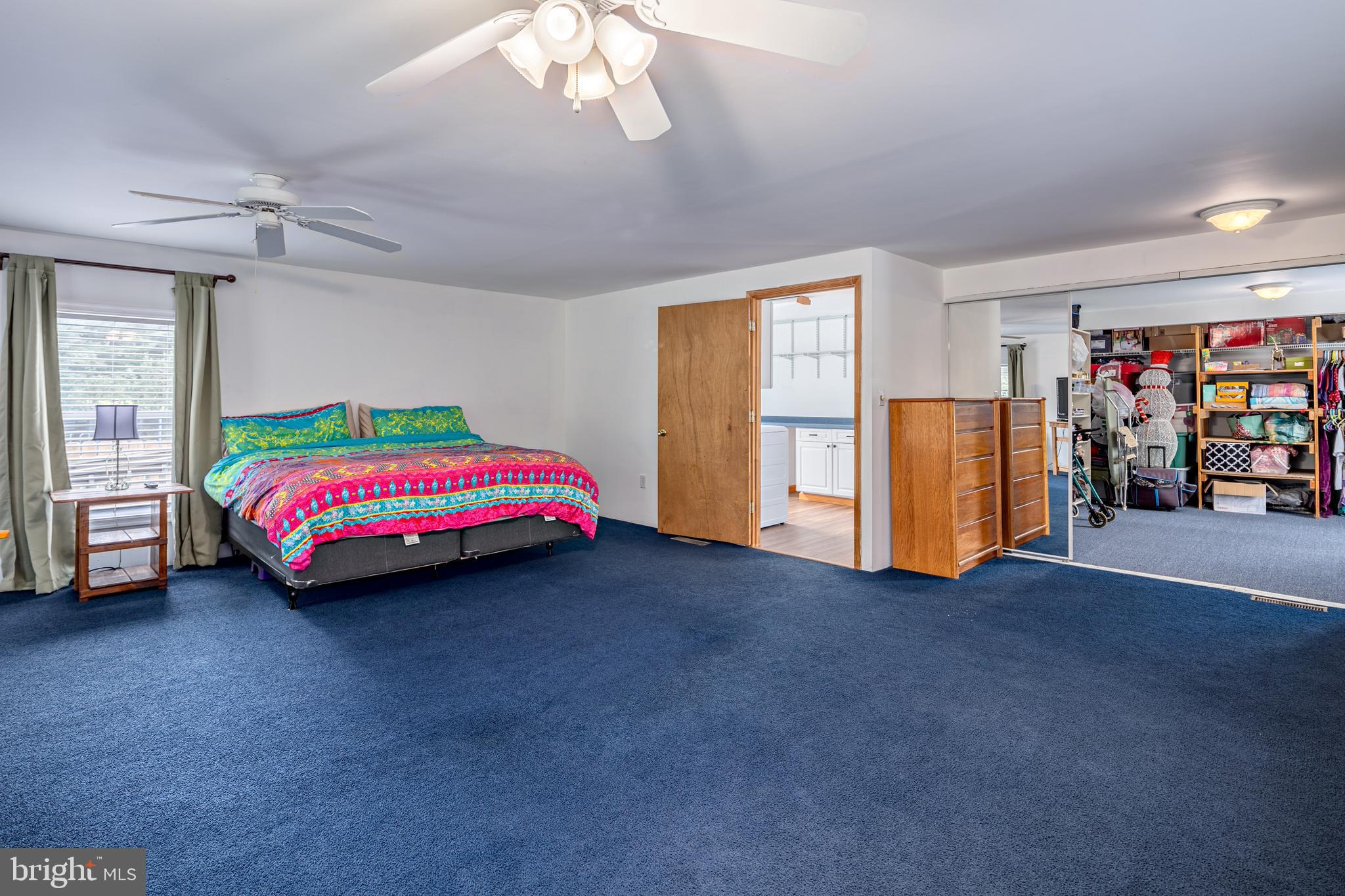 1045 Doyle Road Street, MD 21154 - Photo 14 of 49 a room with a bed and a chandelier