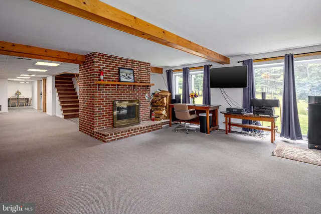 a view of a livingroom with furniture and a flat screen tv