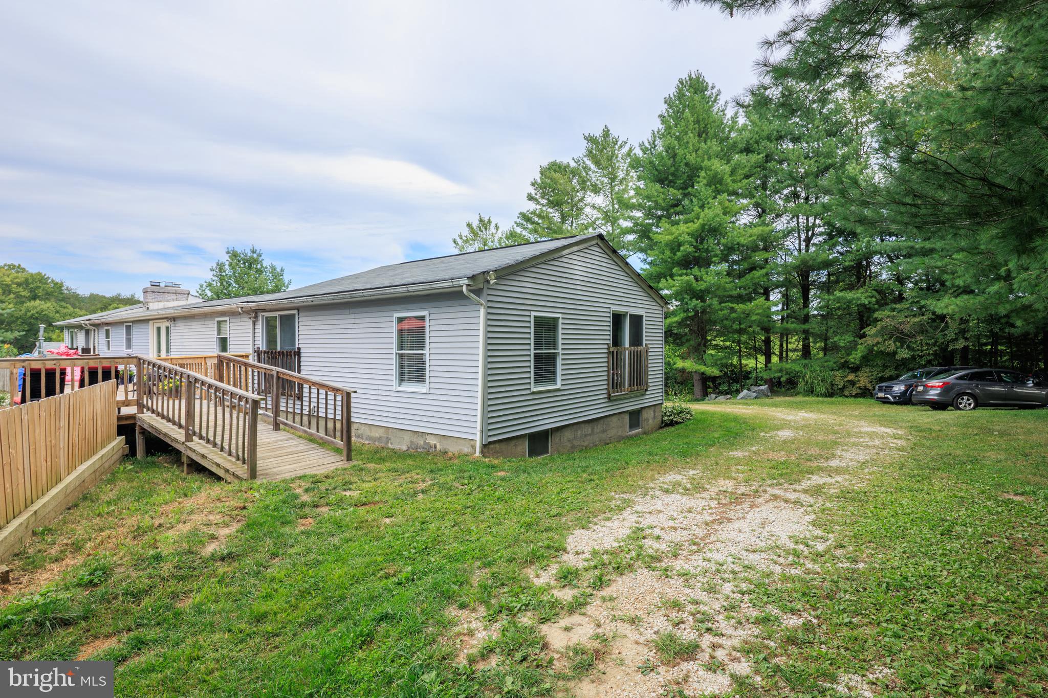 1045 Doyle Road Street, MD 21154 - Photo 45 of 49 a view of a house with a yard and sitting area