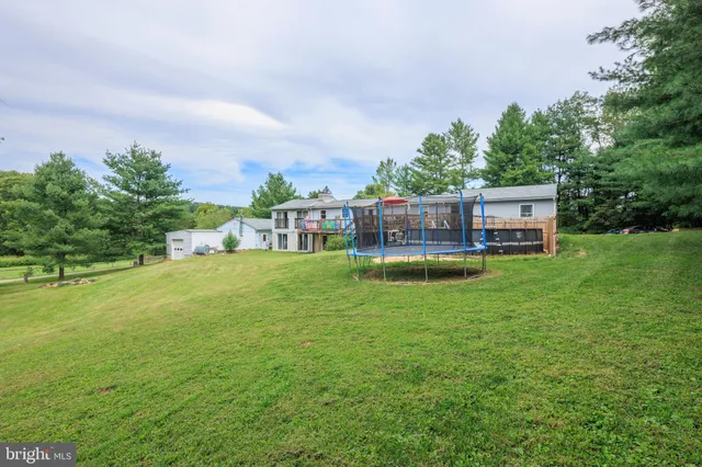 a view of a house with a big yard