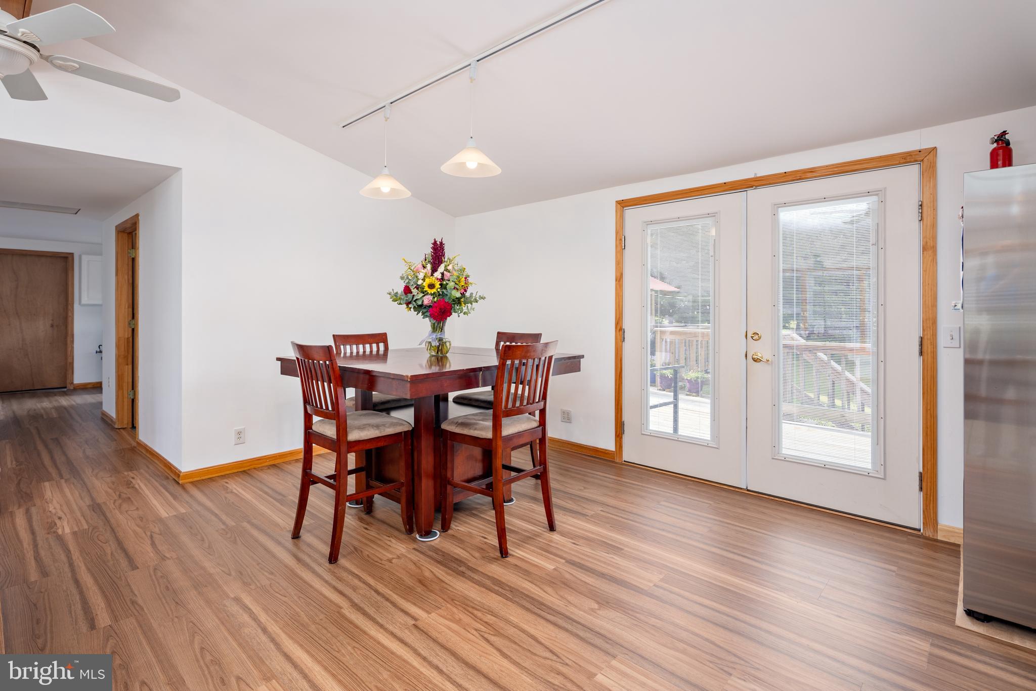 1045 Doyle Road Street, MD 21154 - Photo 6 of 49 a view of a dining room with furniture and wooden floor
