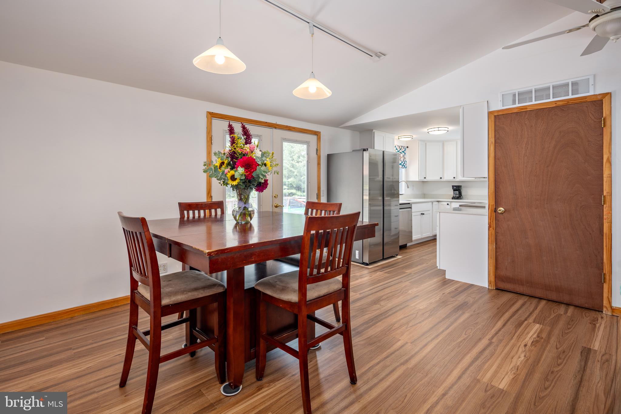 1045 Doyle Road Street, MD 21154 - Photo 7 of 49 a view of a dining room with furniture and wooden floor