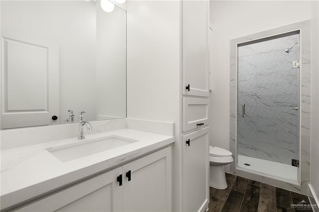 3309 South Marla Court Edinburg, TX 78539 - Photo 6 of 6 a bathroom with a sink toilet and shower
