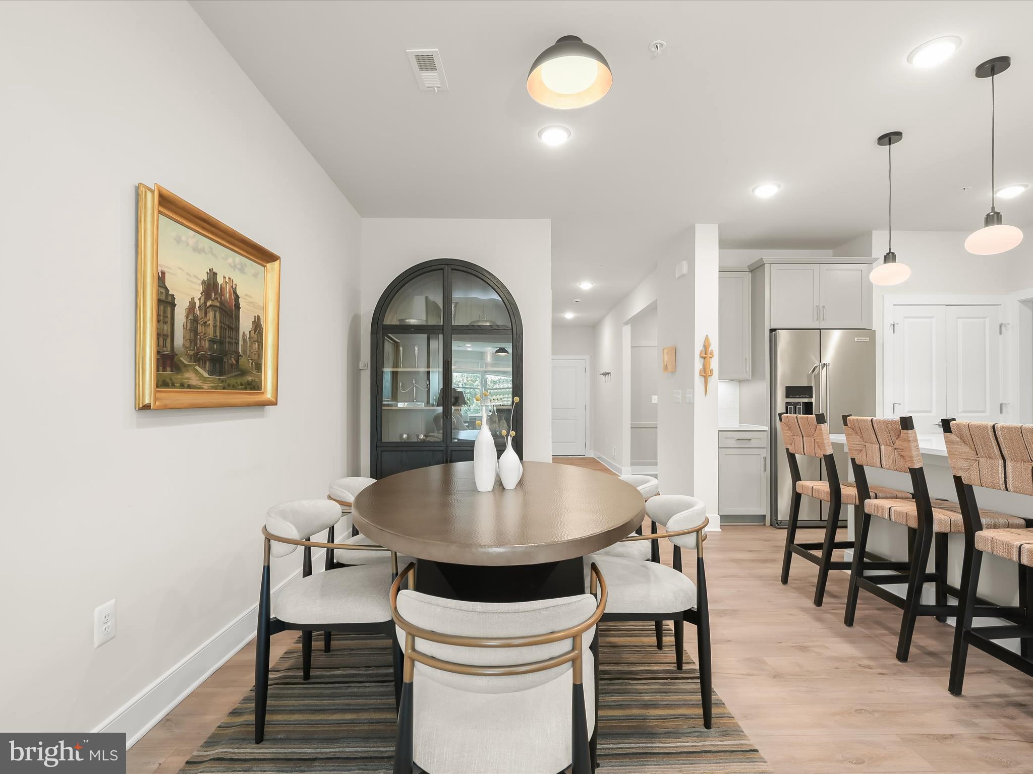 8023 Jennys Way, Unit 9 Fulton, MD 20759 - Photo 11 of 46 a dining room with furniture and wooden floor
