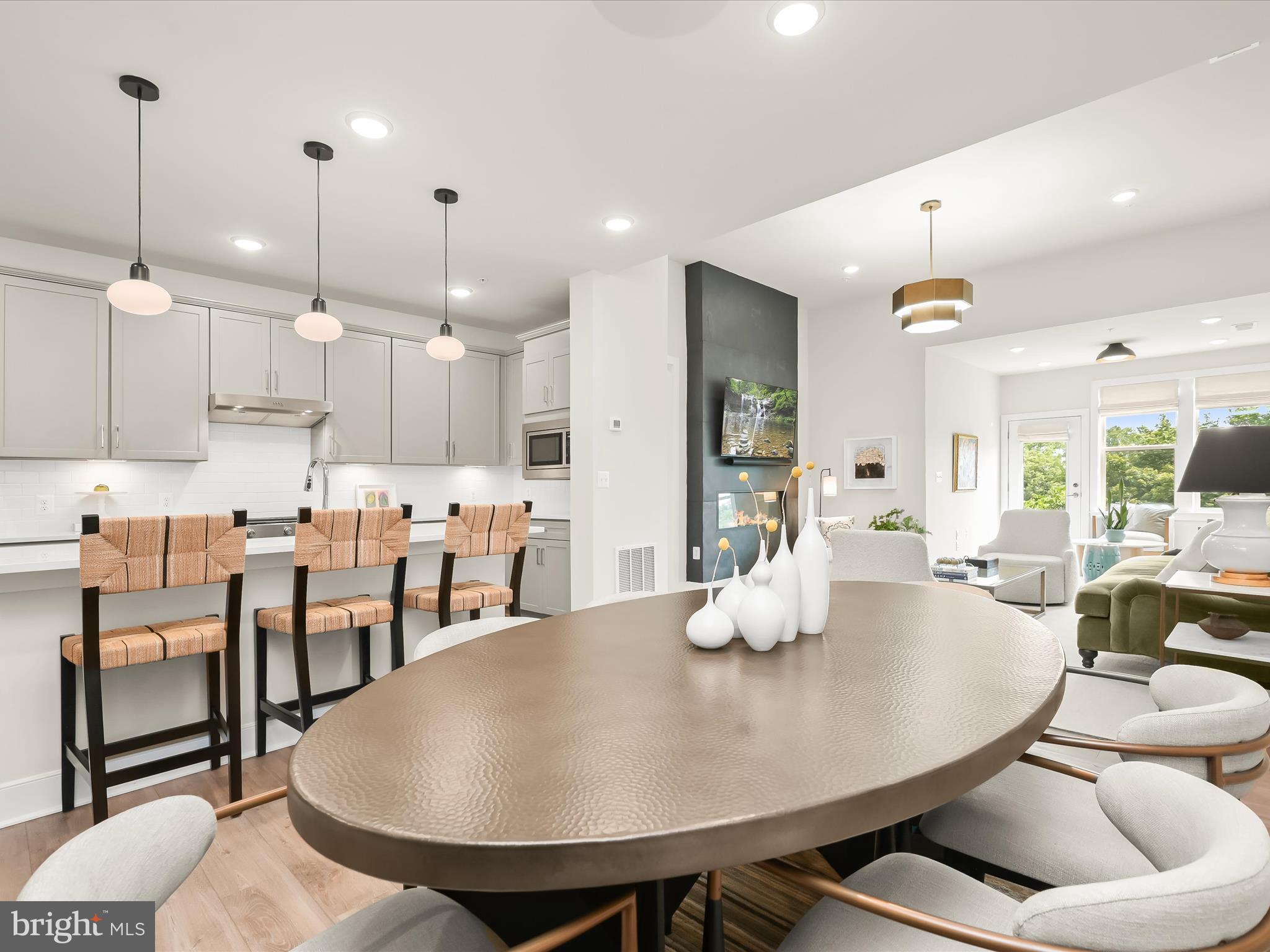 8023 Jennys Way, Unit 9 Fulton, MD 20759 - Photo 13 of 46 a kitchen with counter space dining table and chairs