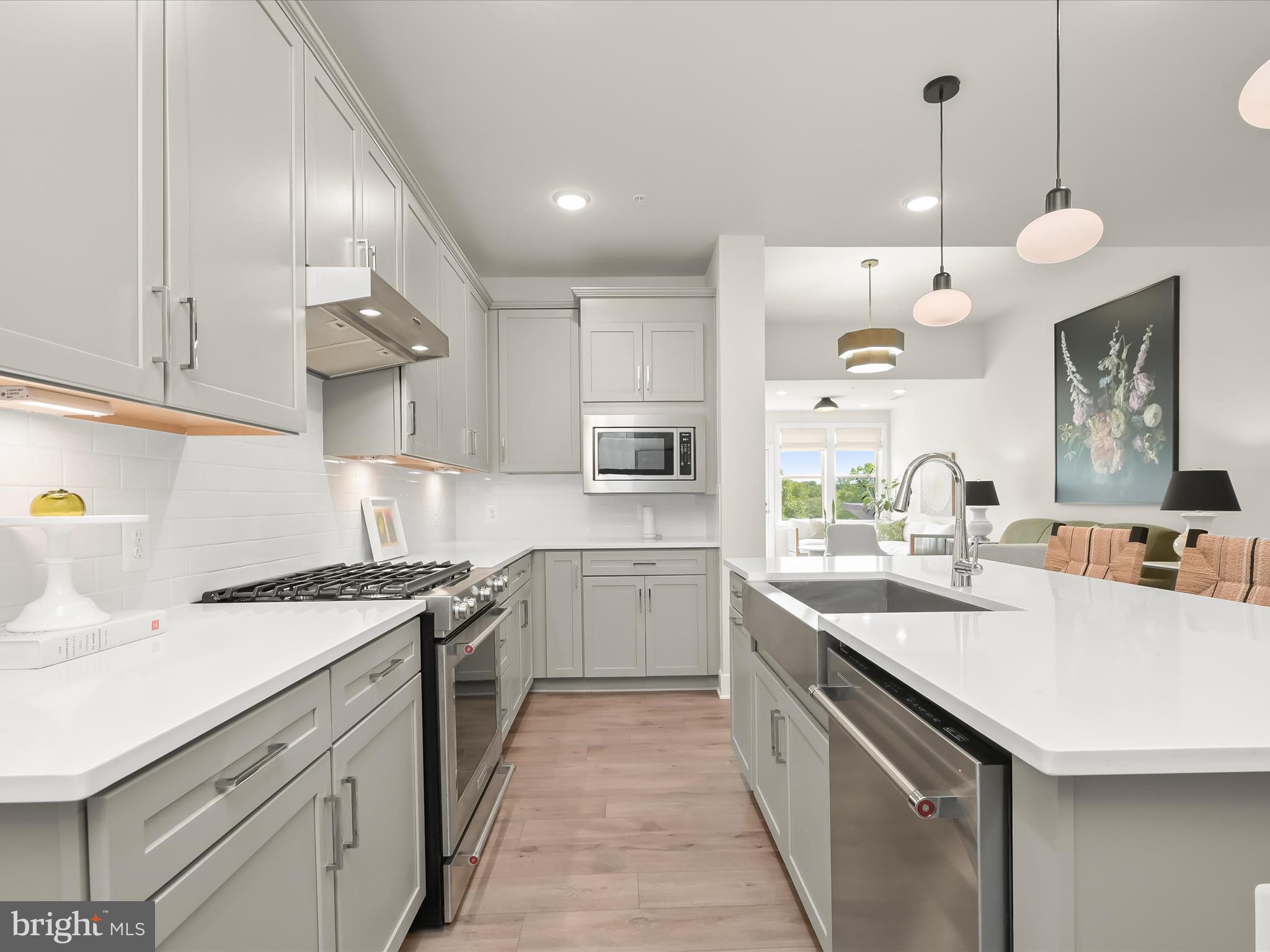 8023 Jennys Way, Unit 9 Fulton, MD 20759 - Photo 16 of 46 a kitchen with a sink a stove and cabinets