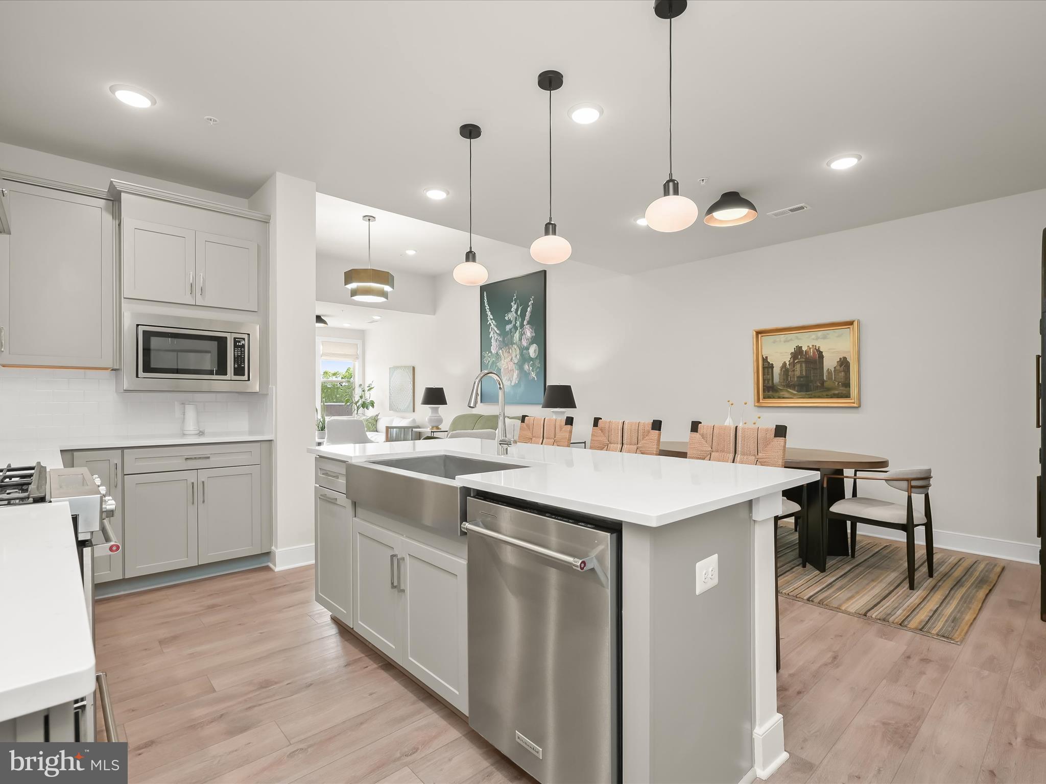 8023 Jennys Way, Unit 9 Fulton, MD 20759 - Photo 17 of 46 a kitchen with a sink a counter top space appliances and cabinets