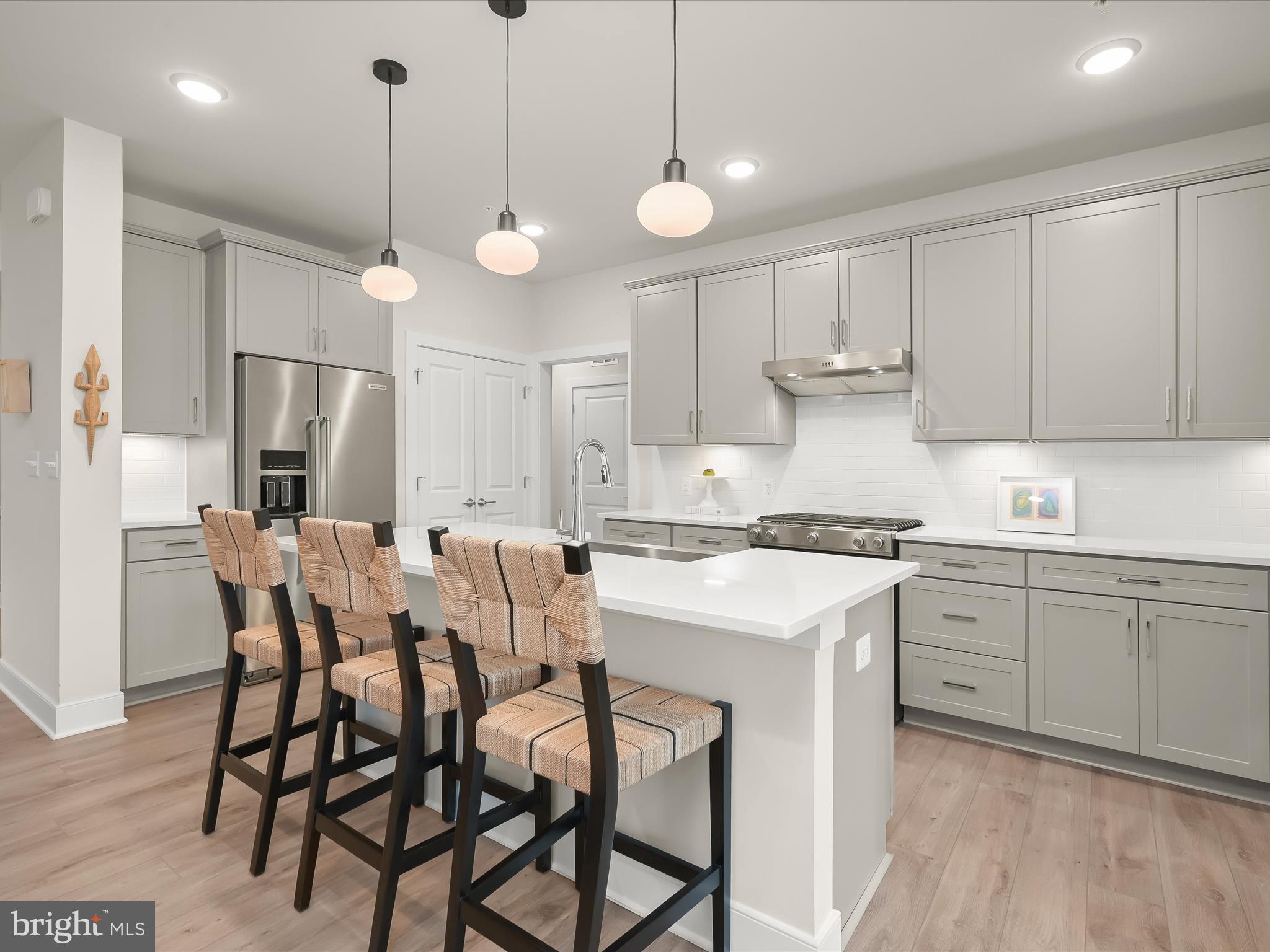 8023 Jennys Way, Unit 9 Fulton, MD 20759 - Photo 19 of 46 a kitchen with a table and chairs in it