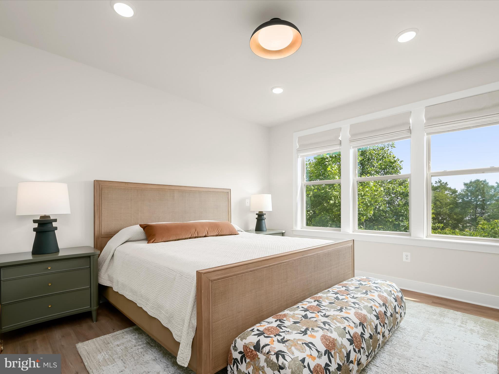 8023 Jennys Way, Unit 9 Fulton, MD 20759 - Photo 21 of 46 a bedroom with a large bed and a large window