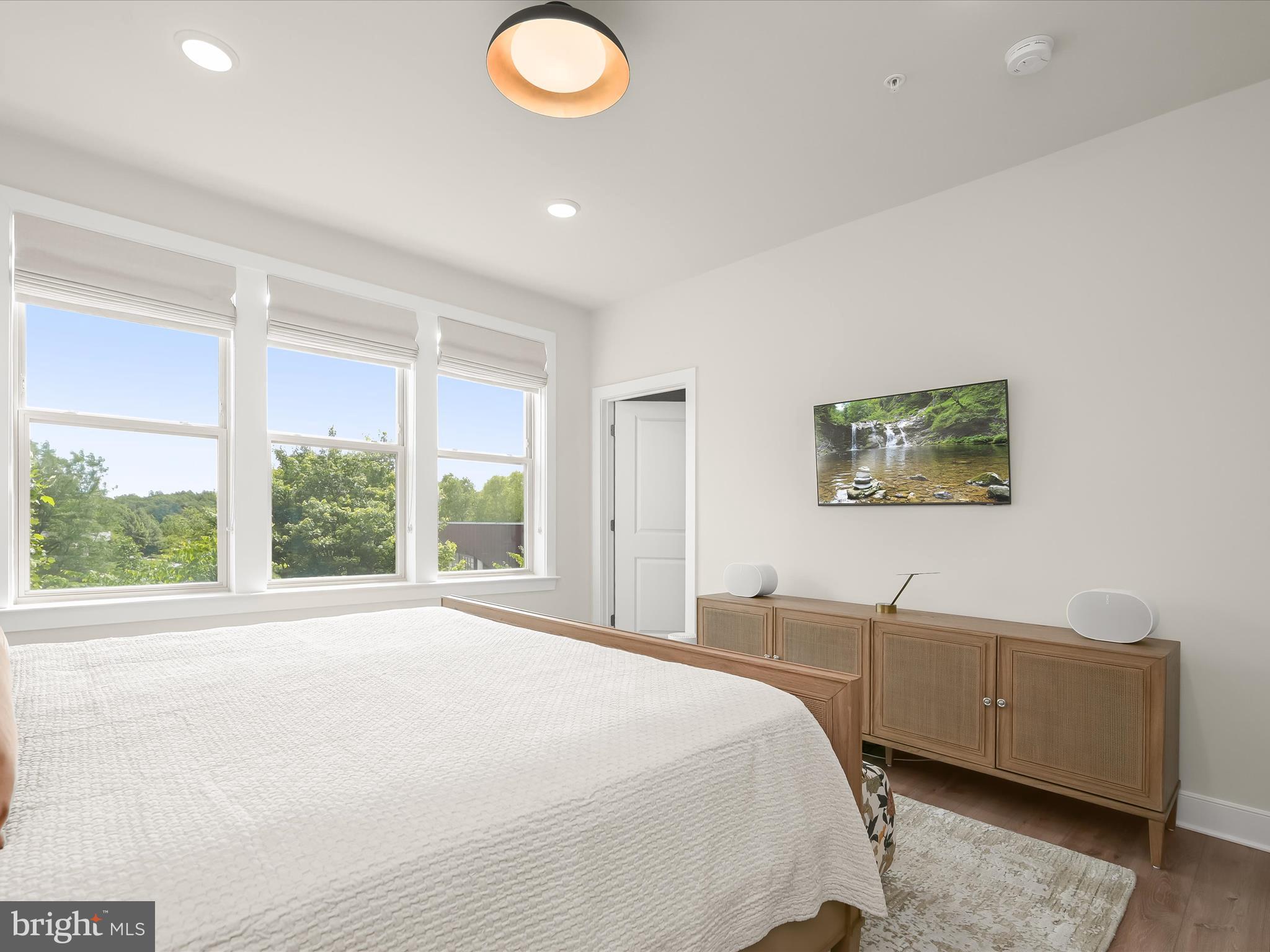 8023 Jennys Way, Unit 9 Fulton, MD 20759 - Photo 22 of 46 a bedroom with a bed and a large window