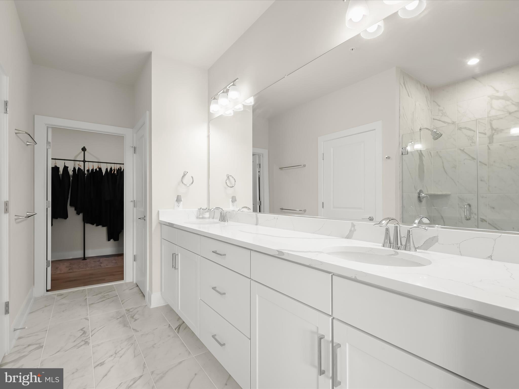 8023 Jennys Way, Unit 9 Fulton, MD 20759 - Photo 24 of 46 a bathroom with a sink and a mirror