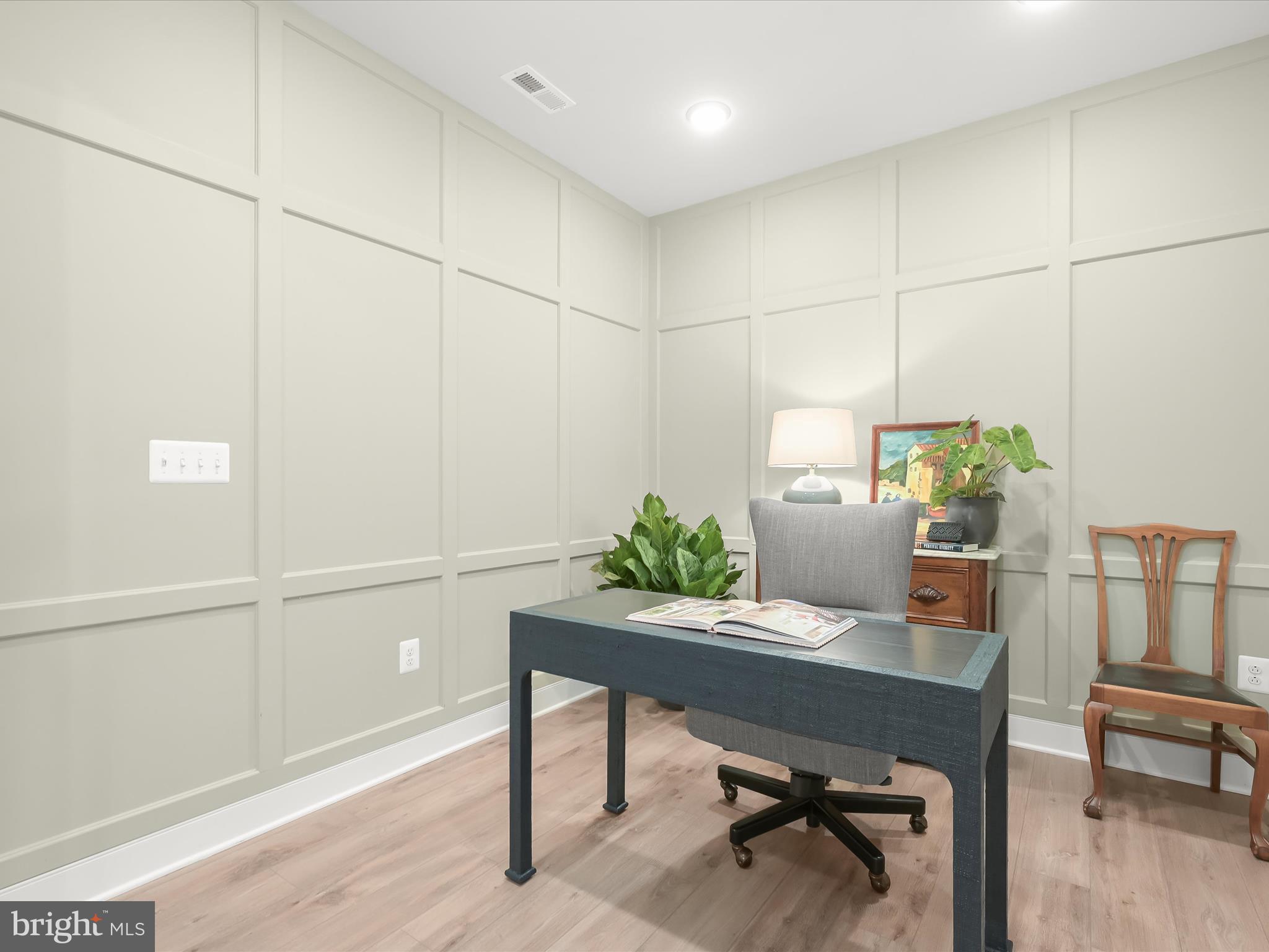 8023 Jennys Way, Unit 9 Fulton, MD 20759 - Photo 29 of 46 a workspace with furniture and a potted plant