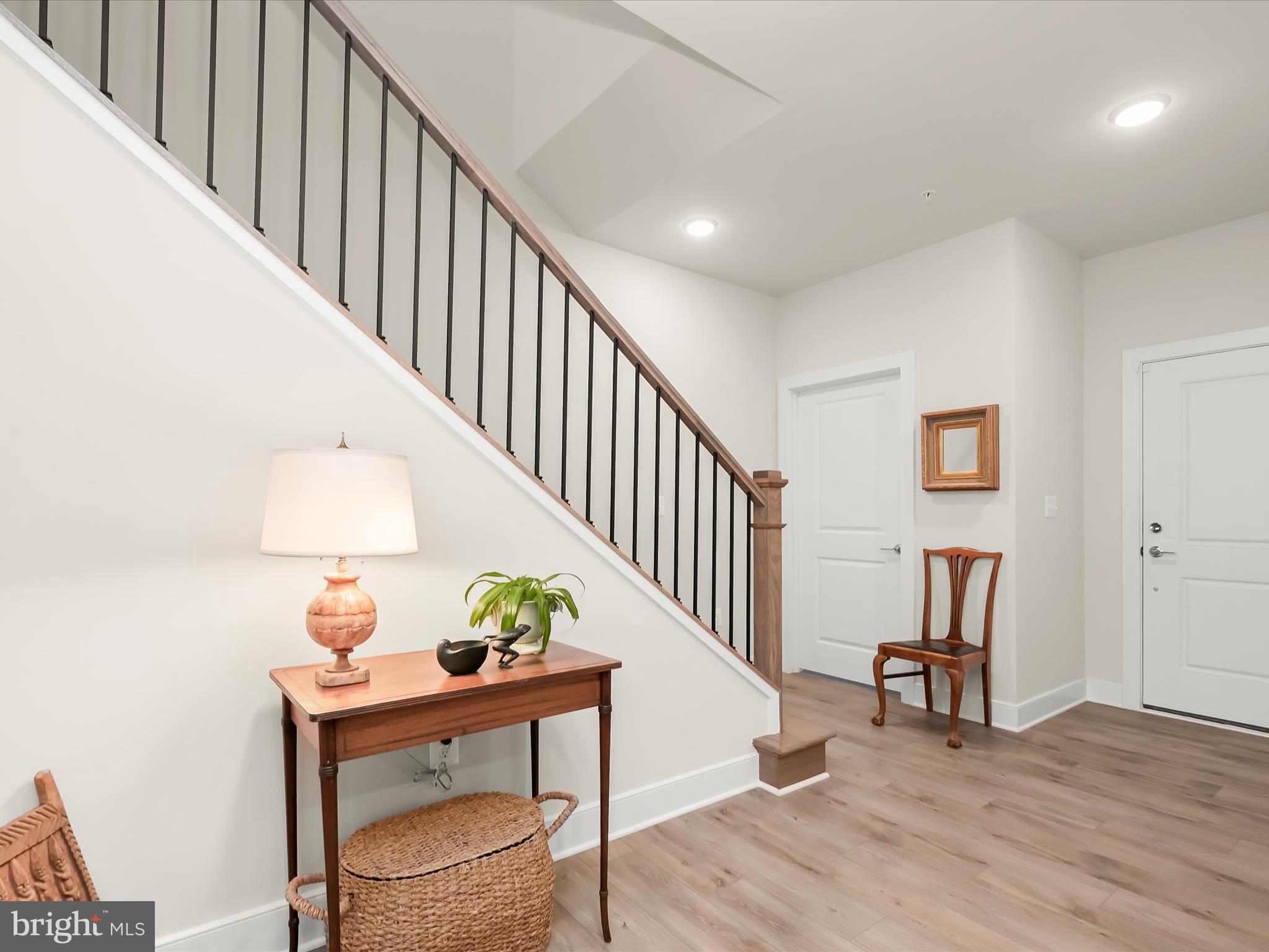 8023 Jennys Way, Unit 9 Fulton, MD 20759 - Photo 31 of 46 a view of entryway livingroom and hall with wooden floor
