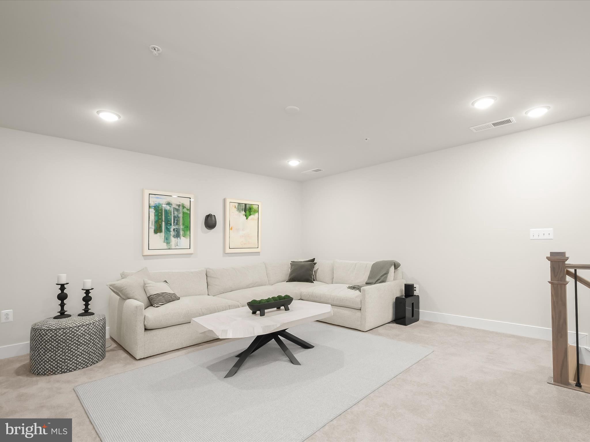 8023 Jennys Way, Unit 9 Fulton, MD 20759 - Photo 33 of 46 a living room with furniture and a couch