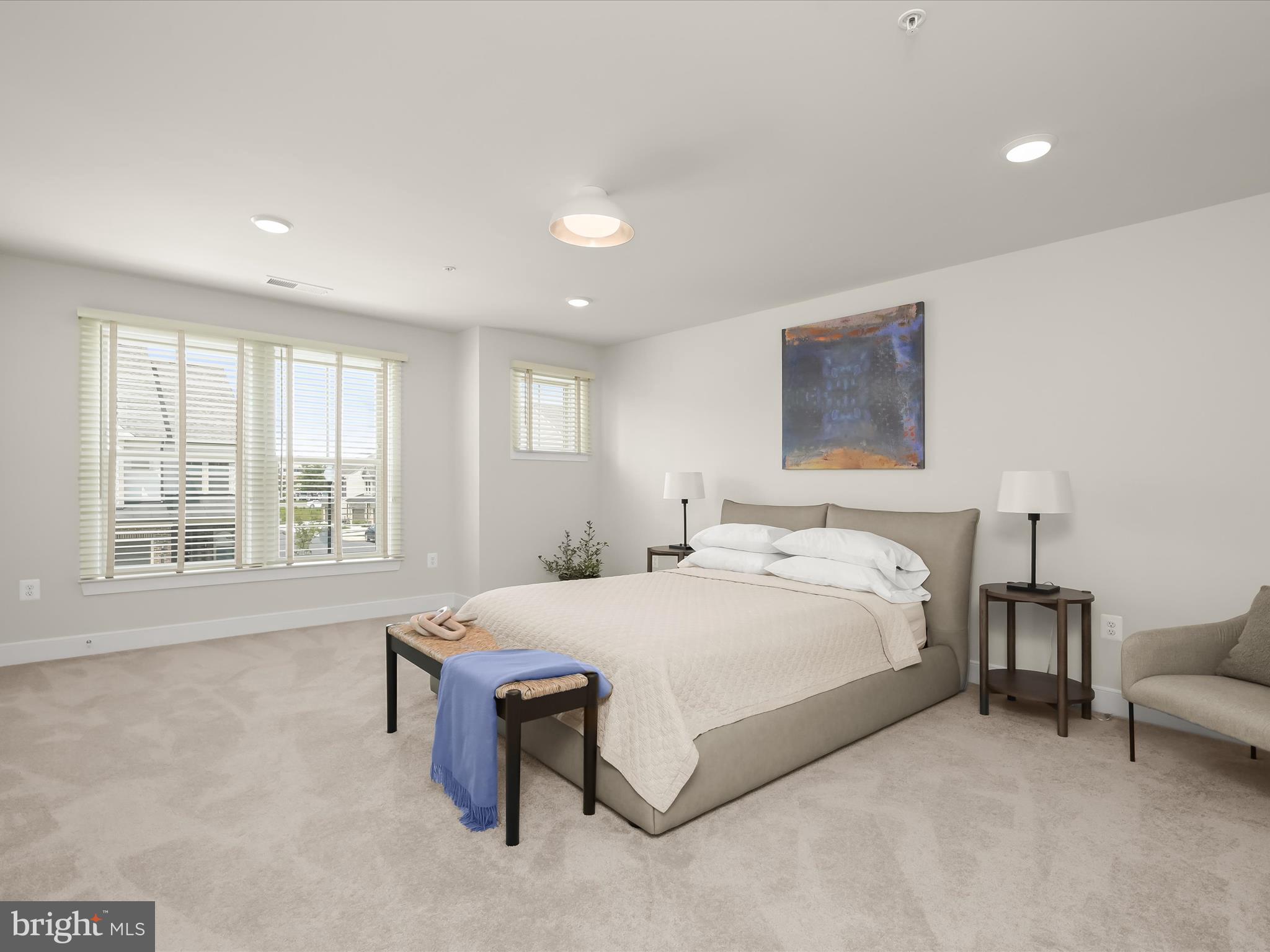 8023 Jennys Way, Unit 9 Fulton, MD 20759 - Photo 35 of 46 a spacious bedroom with a bed and a large window