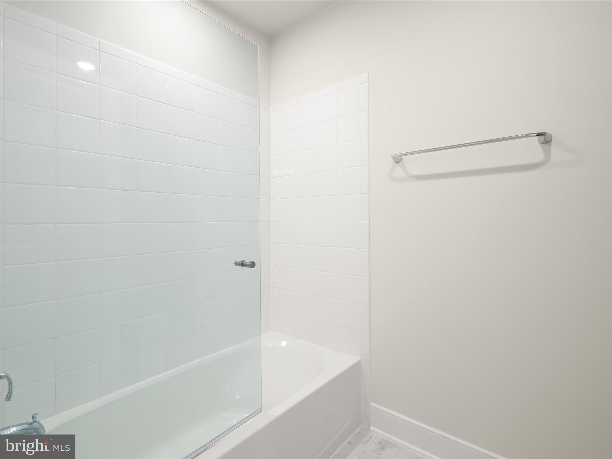 8023 Jennys Way, Unit 9 Fulton, MD 20759 - Photo 39 of 46 a bathroom with a bathtub